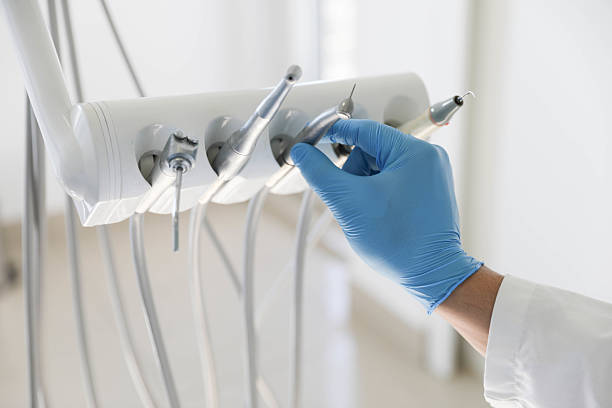 Professional Tooth Extraction technician working in Rhome, TX